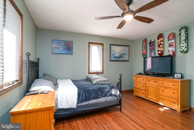 bedroom featuring light hardwood / wood-style floors and ceiling fan