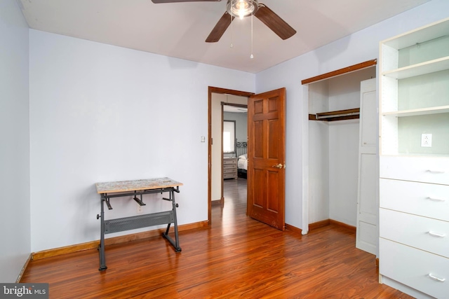 bedroom with wood-type flooring, a closet, and ceiling fan