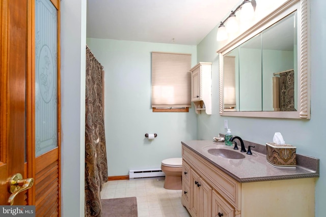 bathroom featuring vanity, toilet, and a baseboard heating unit