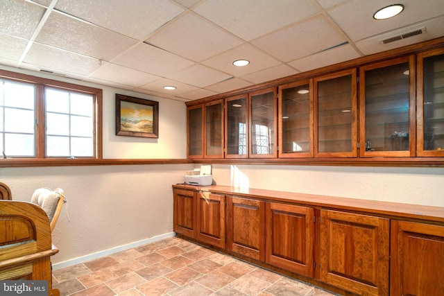 bar featuring a drop ceiling