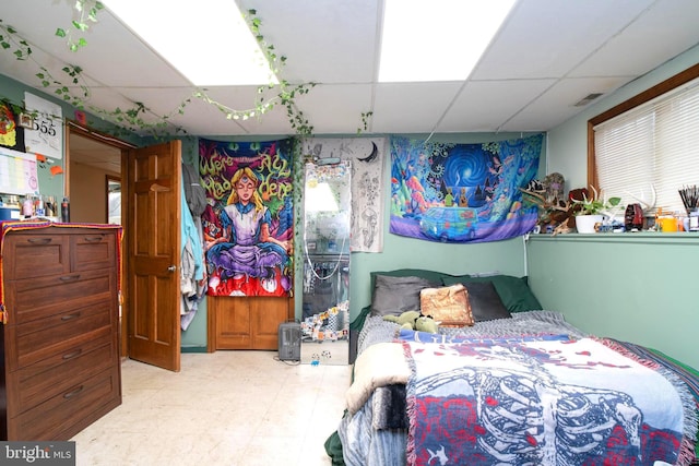 bedroom featuring a drop ceiling