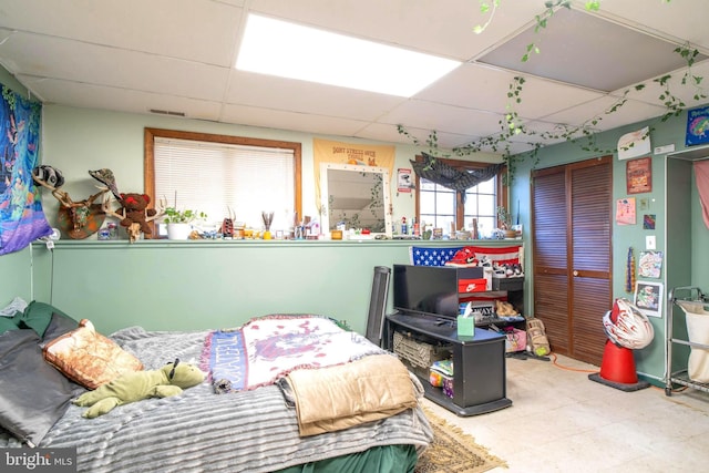 bedroom with a drop ceiling