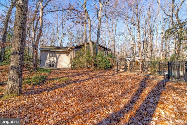 view of yard with a wooden deck