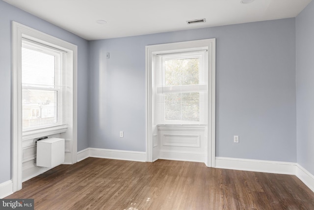 empty room featuring hardwood / wood-style flooring