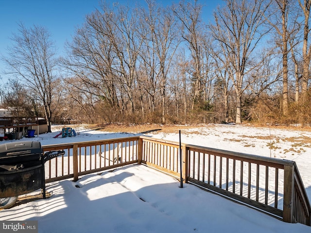 snow covered deck with area for grilling