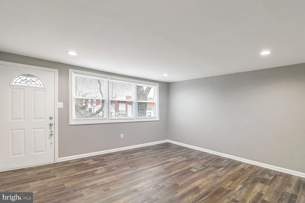 entrance foyer with dark hardwood / wood-style floors