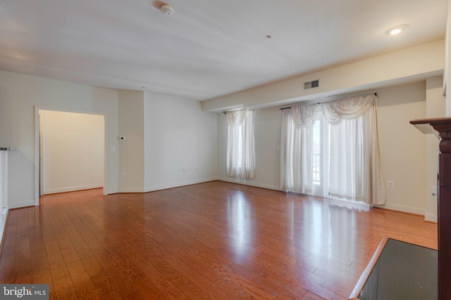 10205 Wincopin Cir Unit 405, Columbia, MD 21044 - unfurnished living room with wood finished floors