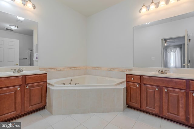 10205 Wincopin Cir Unit 405, Columbia, MD 21044 - bathroom with two vanities, tile patterned floors, a garden tub, and an enclosed shower