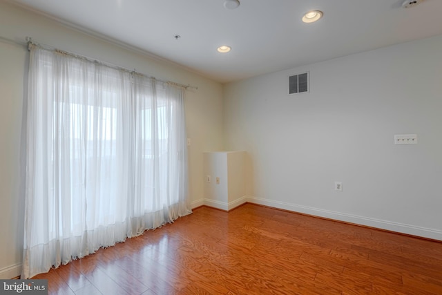 10205 Wincopin Cir Unit 405, Columbia, MD 21044 - unfurnished room with wood finished floors, recessed lighting, and a smoke detector