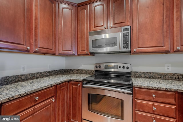 10205 Wincopin Cir Unit 405, Columbia, MD 21044 - kitchen with appliances with stainless steel finishes and light stone countertops