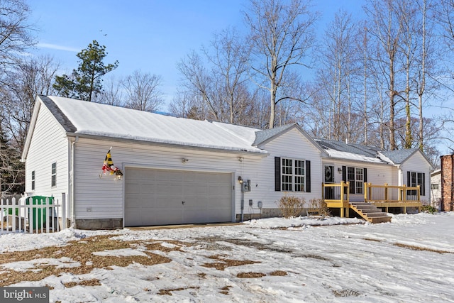 view of front facade featuring a garage and a deck