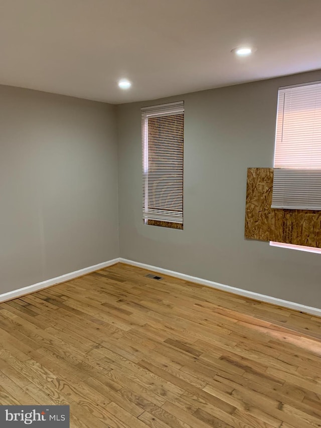 unfurnished room featuring light hardwood / wood-style floors