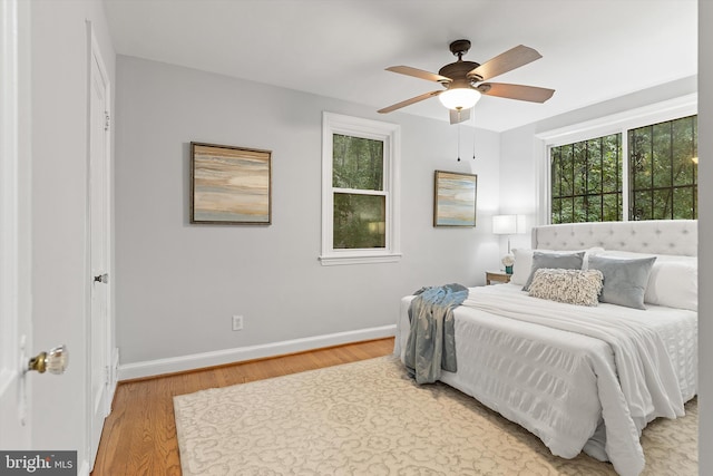 bedroom featuring ceiling fan and hardwood / wood-style floors