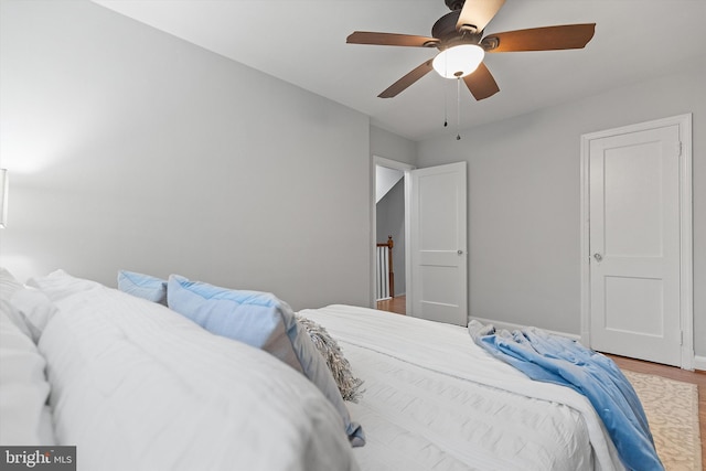 bedroom featuring ceiling fan and hardwood / wood-style flooring