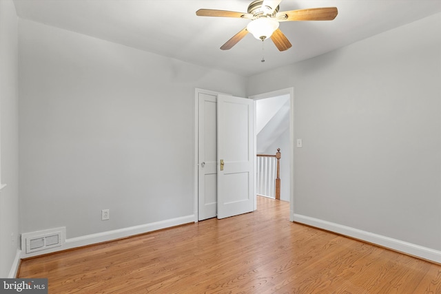 spare room featuring ceiling fan and light wood-type flooring