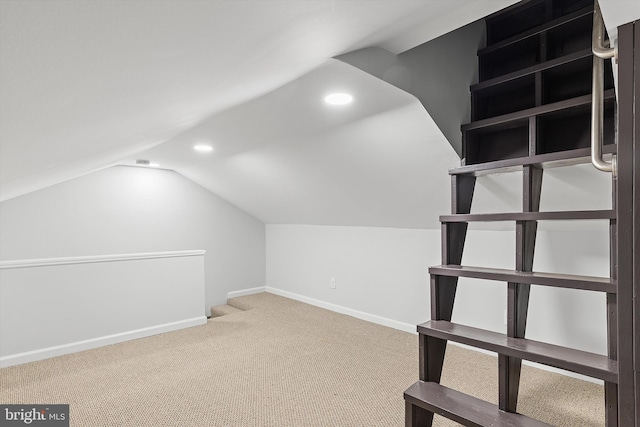 additional living space with carpet and vaulted ceiling