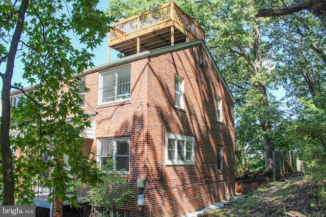 view of property exterior featuring a balcony