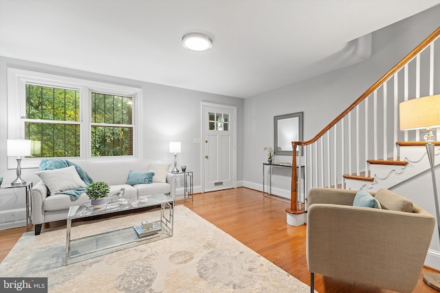 living room with light hardwood / wood-style flooring