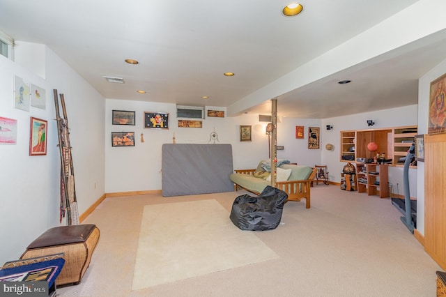 living area with light colored carpet