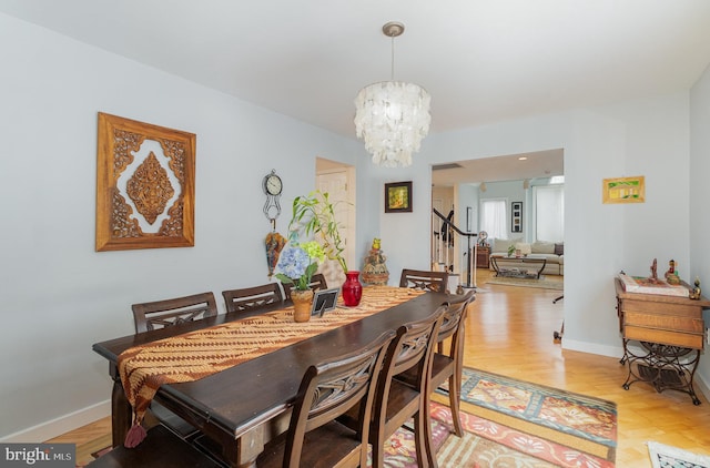 dining room featuring light hardwood / wood-style floors and an inviting chandelier