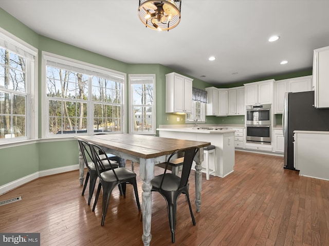 dining area featuring dark hardwood / wood-style flooring