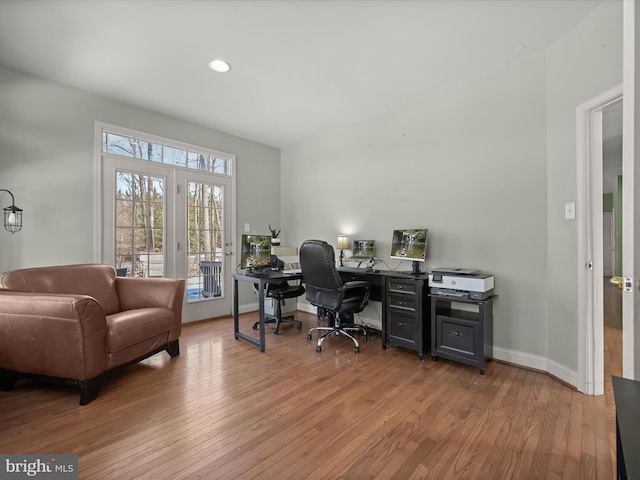 office with light wood-type flooring