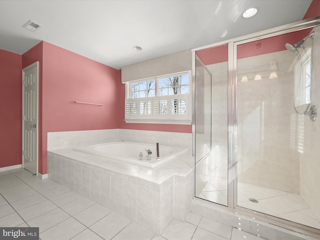 bathroom with separate shower and tub, tile patterned floors, and a wealth of natural light