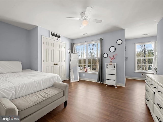 bedroom with ceiling fan and dark hardwood / wood-style floors