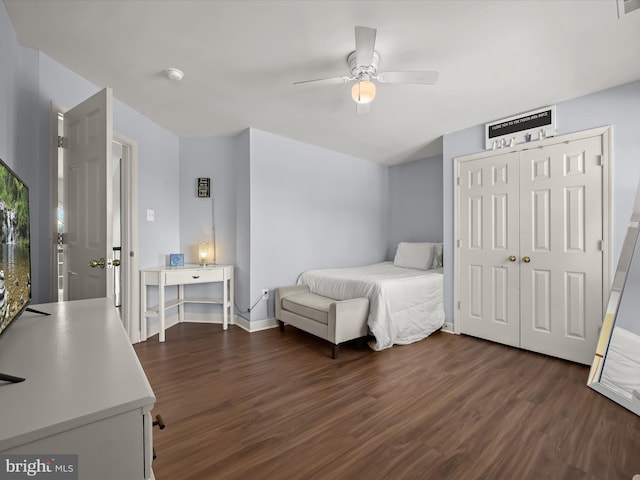 bedroom featuring ceiling fan, a closet, and dark hardwood / wood-style floors