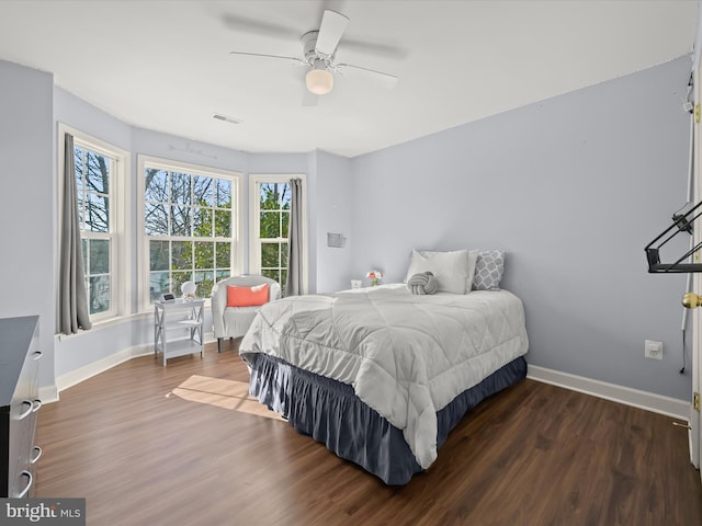 bedroom featuring dark hardwood / wood-style flooring and ceiling fan