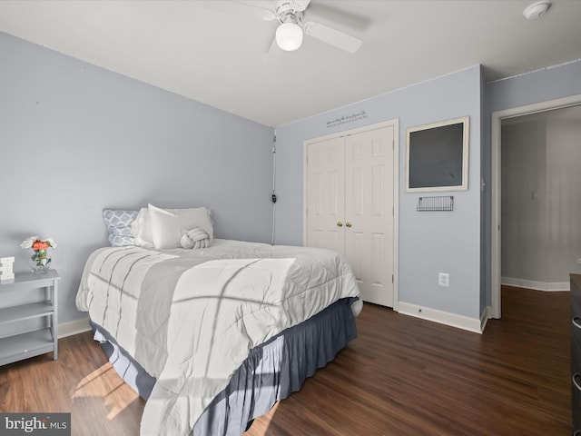 bedroom featuring a closet, ceiling fan, and dark hardwood / wood-style flooring