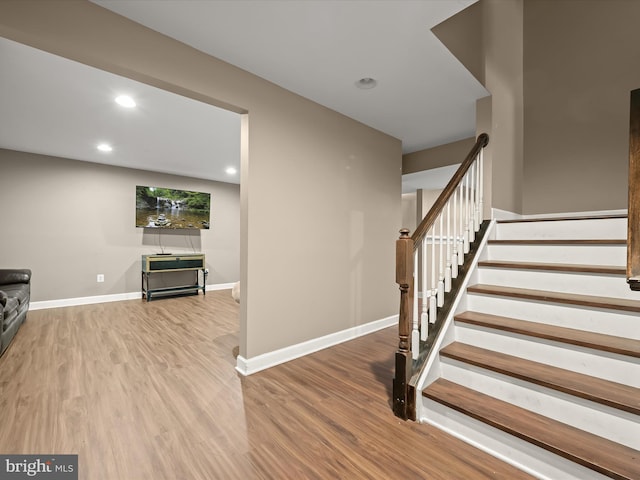 stairway featuring hardwood / wood-style floors