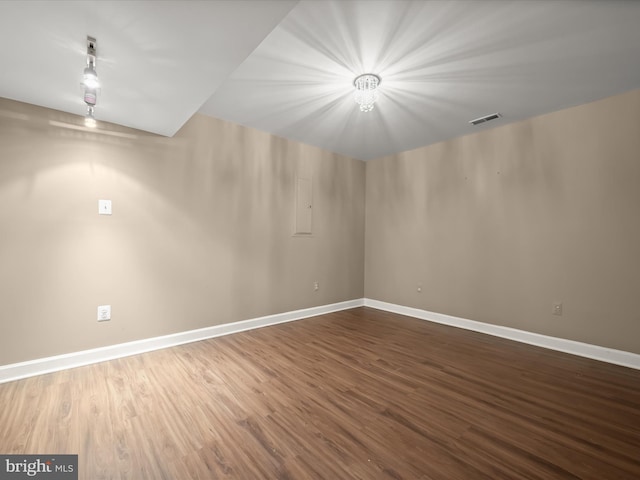 empty room featuring hardwood / wood-style flooring