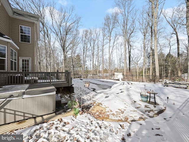 yard covered in snow featuring a wooden deck