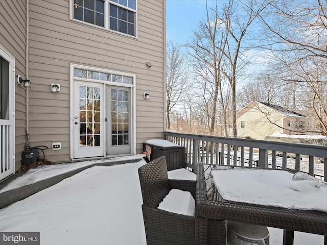 view of snow covered deck