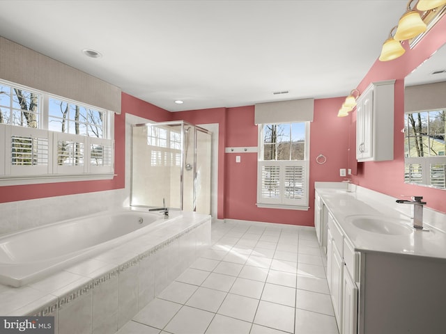 bathroom with independent shower and bath, tile patterned flooring, and vanity