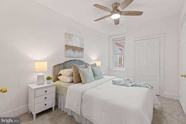 carpeted bedroom with ceiling fan