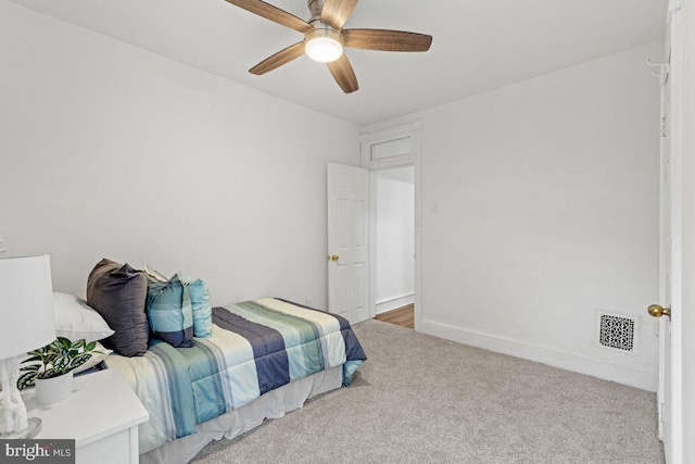 bedroom featuring light carpet and ceiling fan