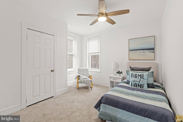 carpeted bedroom featuring ceiling fan