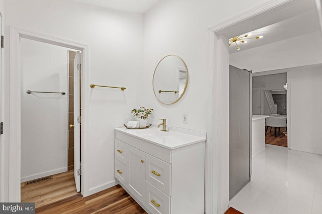 bathroom featuring vanity and hardwood / wood-style flooring