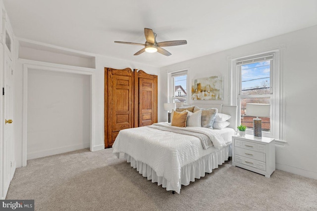 carpeted bedroom featuring ceiling fan