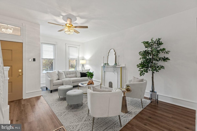 living room with ceiling fan and hardwood / wood-style flooring