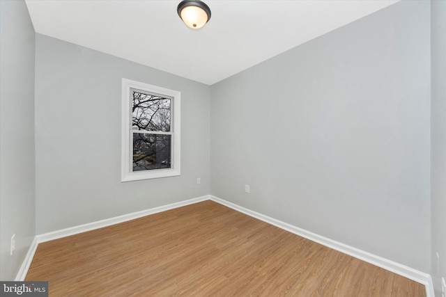 unfurnished room featuring hardwood / wood-style flooring