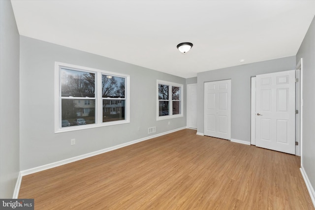 unfurnished bedroom featuring light hardwood / wood-style floors