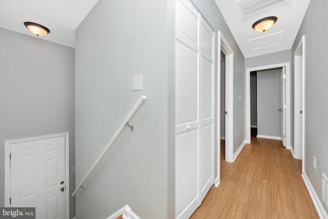 hallway with light wood-type flooring