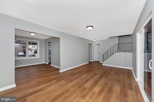 empty room with hardwood / wood-style floors