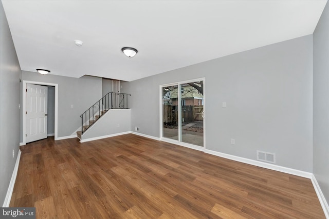 unfurnished living room featuring wood-type flooring