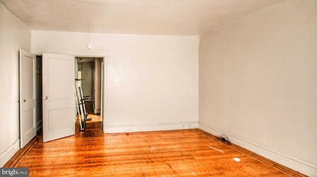 unfurnished room featuring hardwood / wood-style floors