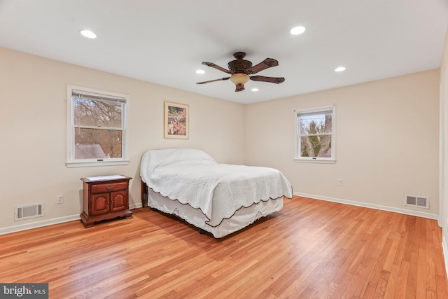 bedroom with ceiling fan and light hardwood / wood-style flooring