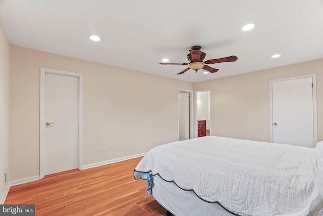 bedroom with hardwood / wood-style flooring and ceiling fan